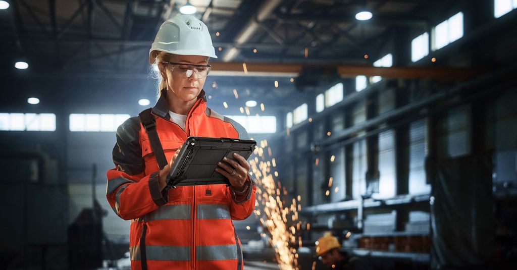 Factory worker using rugged tablet